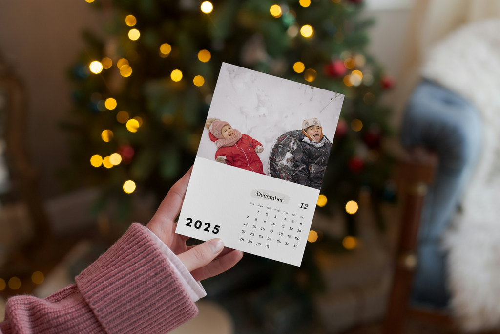 Personalized Photo Calendar with Clipboard for Display from Nuts & Bolts Paper Co in front of Christmas Tree